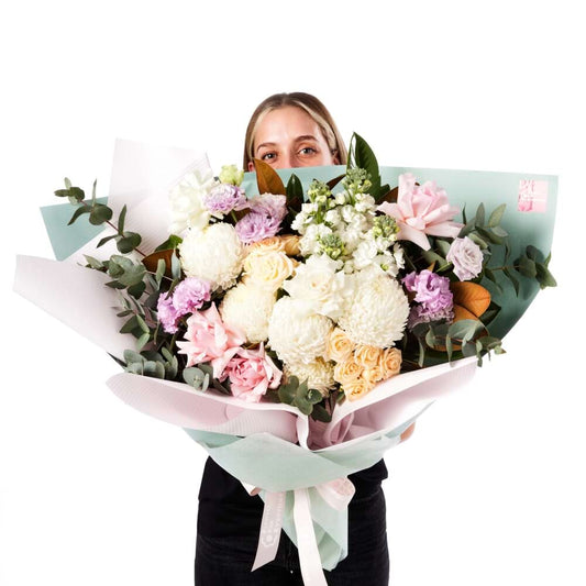 Sweet Sorbet Premium Bouquet with pastel chrysanthemums roses lisianthus and eucalyptus wrapped in soft pink and green paper for same day delivery flowers