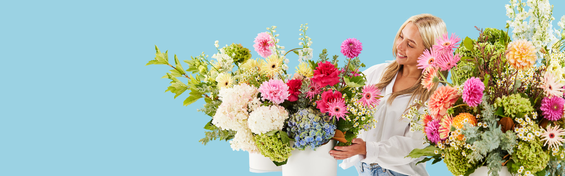Florist arranging colourful fresh flowers
