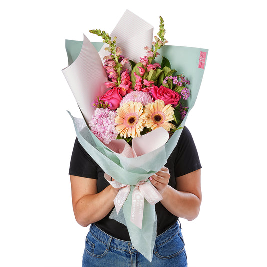 Blissful Pink Bouquet with pink roses gerberas hydrangeas and seasonal blooms wrapped in soft pastel paper for birthdays or special occasions