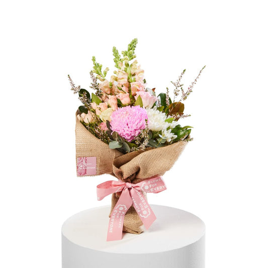 Sweet Pink Posy featuring pink chrysanthemums peach blooms and fresh greenery wrapped in burlap for birthday flowers and same day delivery flowers