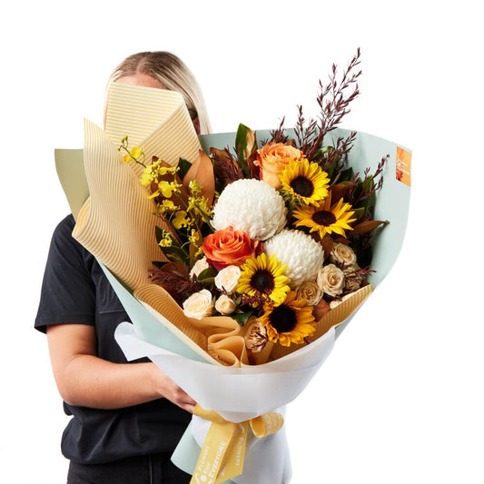 Simulated alt text for The Sunrise Bouquet for flowers-for-everyone-au.myshopify.com. You are an expert SEO agent. You will generate an ALT text for this image. <Store_Context> Business Details: - Same-day flower delivery service for convenience ...