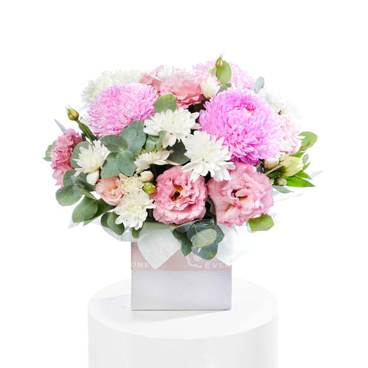 Sweet And Petite Flower Box with pink lisianthus roses white daisies and lush greenery for special occasion flowers and same day flower delivery