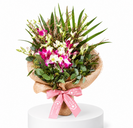 Lush Orchid Posy with pink and white orchids lush greenery and rustic wrap for thank you flowers and same day delivery flowers