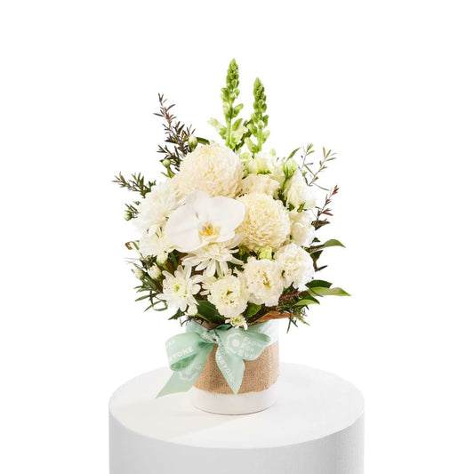 From the Heart Arrangement with white orchids chrysanthemums and lush greenery for sympathy flowers and same day flower delivery