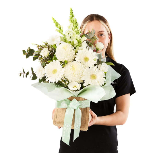Eco Elegance Basket with elegant white flowers in a rustic basket for sympathy or special occasion gifting from Flowers for Everyone with same day delivery