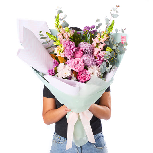 PURPLE PARADISE BOUQUET with pink and purple roses chrysanthemums and eucalyptus for birthday flowers graduation flowers and same day delivery flowers